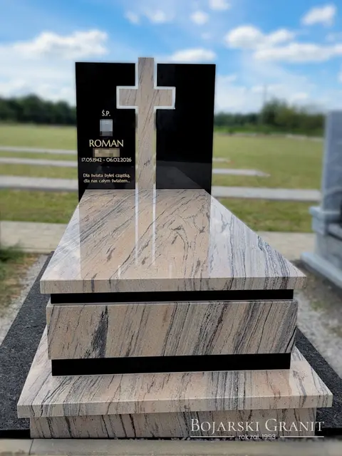 Nagrobek pojedynczy z granitów "Prada Gold" i "Warangal Black" z przestrzennym krzyżem