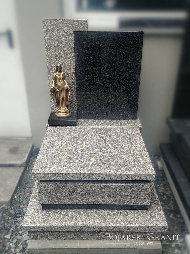 Nagrobek urnowy z granitów "Brąz Królewski" oraz "Impala" z figurą Matki Boskiej